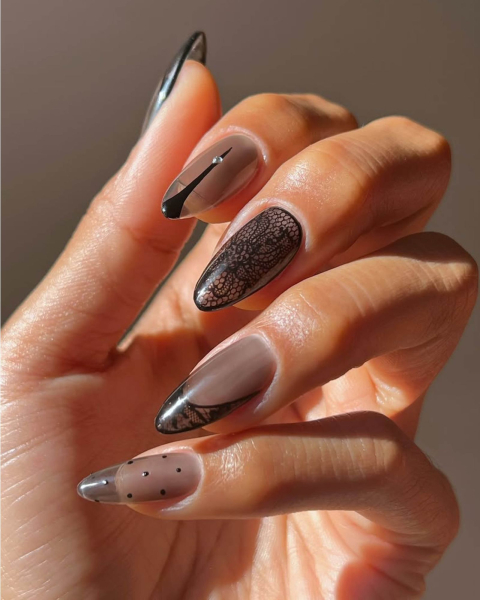 Lacy black sheer nails with french tip and tiny polka dot designs.